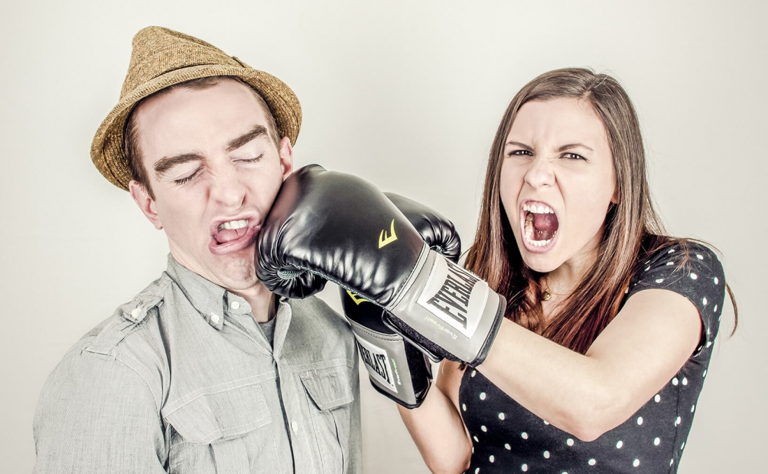 Two people fighting. They mean it! | 5 reasons you should stop fighting over your nonprofit’s home page